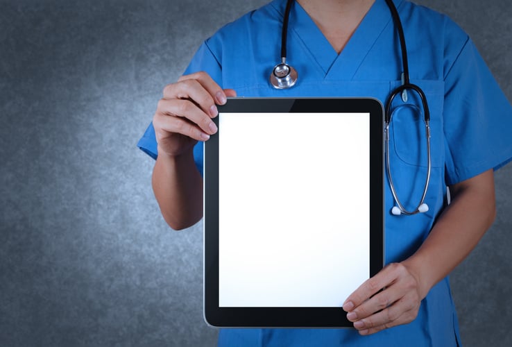 doctor utilizing digital documentation on a tablet